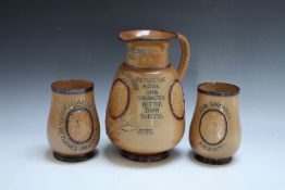 A LARGE DOULTON LAMBETH STONEWARE POLITICAL SINGLE HANDED EWER AND TWO BALUSTER VASES, the ewer