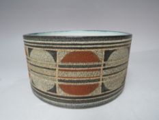A TROIKA POTTERY BOWL, ovoid form, circular base, textured ground with decorative border, hand