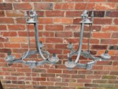 A PAIR OF FRENCH GALVANISED CAST METAL THREE BRANCH CHANDELIERS, having armorial style plaques