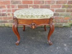 A LATE 19TH CENTURY ROSEWOOD UPHOLSTERED STOOL, the shaped drop in seat covering a lined