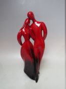 A ROYAL DOULTON FLAMBE PROTOTYPE DEPICTING A YOUNG MAN & WOMAN, marked to base Property of Royal