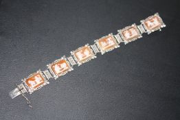 AN UNUSUAL CAMEO PANEL BRACELET, set in white metal stamped 800, approx weight 21.2g, L 18 cm