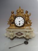 A FRENCH GILT SPELTER AND ALABASTER FIGURAL CLOCK, enamel dial with Roman numerals, single train