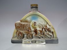 A VINTAGE SEALED CERAMIC 'HAROLDS CLUB' DECANTER OF BEAM 100 MONTHS OLD KENTUCKY STRAIGHT BOURBON