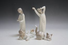A SELECTION OF FOUR LLADRO FIGURES, comprising a young boy yawning, a young girl with candle, a