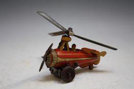 A VINTAGE GERMAN TIN PLATE CLOCKWORK HELICOPTER marked 'D.R.G.M. GERMANY', with key, L 10 cm