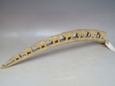 AN ANTIQUE IVORY CARVED TUSK ELEPHANT TRAIN, circa 1900 / 1910, L 54 cm