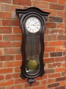 A DOUBLE WEIGHTED SERPENTINE REGULATOR VIENNA WALL CLOCK, having a mahogany case with arched top,
