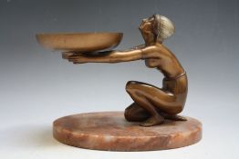 AN ART DECO BRONZED STYLE CLASSICAL SEMI-NUDE FEMALE KNEELING HOLDING A LARGE CIRCULAR PAN IN HER