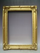 A 19TH CENTURY ART NOUVEAU GOLD SWEPT FRAME, frame W 7 cm, frame rebate 48 x 35 cm
