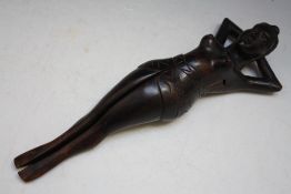 A NOVELTY TREEN NUTCRACKER IN THE FORM OF A FEMALE WITH OPENING LEG, H 33 cm