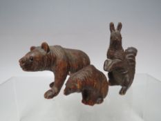 THREE BLACK FOREST WOOD CARVINGS, consisting of two bears and a squirrel, tallest H 8 cm