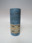 A TROIKA CYLINDRICAL POTTERY VASE, textured blue ground with lower decorative border, hand