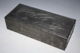 AN ARTS AND CRAFTS STYLE BOX, decorated with three fish to the lid and waves around the main body