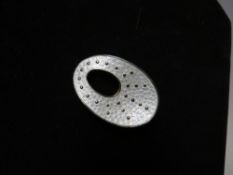 A MID 20TH CENTURY ØYSTEIN BALLE SILVER AND WHITE GUILLOCHE ENAMEL BROOCH, of elliptic form, white
