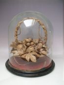 AN UNUSUAL VICTORIAN FRUIT DISPLAY MODELLED FROM LEATHER, on an ebonised and fabric covered base,