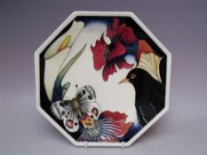 A BOXED MOORCROFT DESIGNERS 'MEDLEY' PATTERN OCTAGONAL PLATE, typical tubelined decoration, multi-