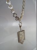 A LATE 19TH CENTURY HALLMARKED SILVER LOCKET, suspended on an antique link silver chain, combined
