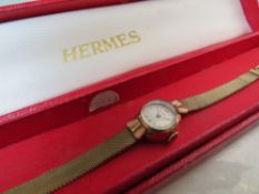 A LADIES VINTAGE HERMES GOLD PLATED WRISTWATCH, complete with original boxCondition Report:Watch