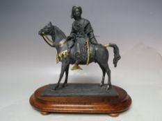 A 20TH CENTURY LEAD FIGURE OF AN ARAB ON HORSEBACK, with gilded embellishment, having a blued
