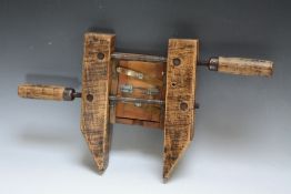 AN UNUSUAL WOODEN PICTURE FRAMING DEVICE