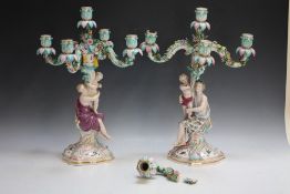 A PAIR OF MEISSEN FIGURAL FIVE BRANCH CANDELABRA, each column modelled as a seated lady holding a