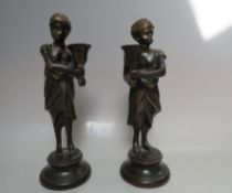 A PAIR OF 20TH CENTURY BRONZED METAL MALE AND FEMALE FIGURATIVE CANDLE HOLDERS, H 25 cm