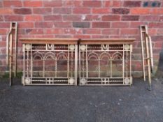 A PAIR OF HEAVY GILDED BRASS CHURCH ALTAR GATES WITH HINGE POSTS, having mahogany top edge,
