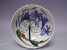 A MOORCROFT FLY AWAY HOME PATTERN FOOTED BOWL, typical tubelined decoration, impressed and painted