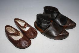 A PAIR OF 19TH CENTURY WOODEN AND LEATHER CHILDRENS CLOGS, together with a pair of late 19th / early