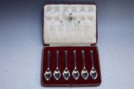 A CASED SET OF SIX HALLMARKED SILVER 'BRITISH HALLMARKS' TEASPOONS, each with a different assay