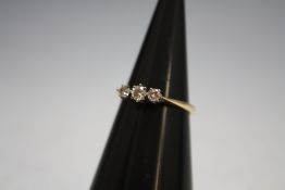 AN 18 CARAT GOLD DIAMOND TRILOGY RING, approx weight 2.1g, ring size M 1/2