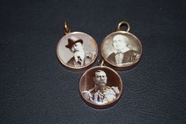 THREE CIRCULAR CHARM BRACELET STYLE PENDANTS, featuring Shakespeare, King Edward and King George V
