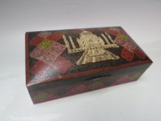 AN INDIAN ENAMELLED BRASS BOX WITH A VIEW OF THE 'TAJ MAHAL', the domed, hinged lid opening to