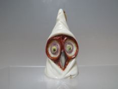 A ROYAL WORCESTER CERAMIC CANDLE SNUFFER MODELLED AS AN OWL WEARING HOODED ROBE, H approx 8cm