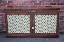 AN ANTIQUE ROSEWOOD TWO DOOR SIDEBOARD, having a classical gilt metal mount to the frieze, the doors
