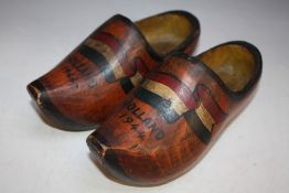 A PAIR OF VINTAGE DUTCH CLOGS DATED 'Holland 1944', decorated with the Dutch flag and coming with