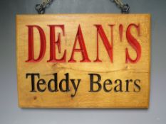A WOODEN DEAN'S TEDDY BEARS ADVERTISING SIGN, W 41.5 cm, H 29.5 cm, D 2.3 cm