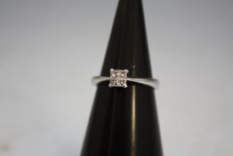 AN 18 CARAT WHITE GOLD FOUR PRINCESS CUT DIAMOND RING, approx weight 3.5g, ring size N