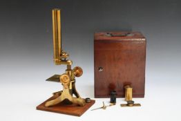 A MAHOGANY CASED BRASS TRAVELLING MICROSCOPE - UNNAMED, with additional lenses, slides etc