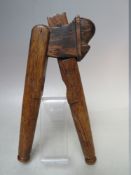 A PAIR OF OAK NUTCRACKERS WITH MOUSE ON TOP, W 21 cm