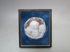 A FRAMED CARVED PORTRAIT CAMEO PLAQUE DEPICTING THE THREE GRACES, the cameo of octagonal form, in