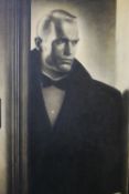 D ASHTON (XX). A portrait study of a man in a doorway, unsigned, oil on canvas, framed, 88 x 63