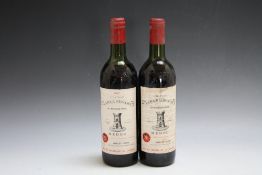 2 BOTTLES OF CHATEAU LA TOUR ST BONNET 1982, one top shoulder, the other mid shoulder
