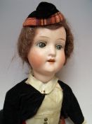 A SCHOENAU & HOFFMEISTER BISQUE HEADED DOLL, blue sleeping eyes, open mouth showing four teeth,