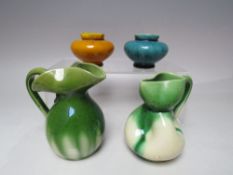 FOUR PIECES OF ART POTTERY, consisting of two Allervale type jugs and two linthorpe style vases, H 6