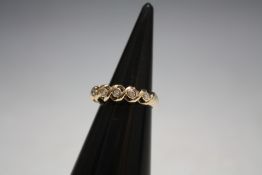 A 9 CARAT GOLD FIVE STONE DIAMOND RING, approx weight 2.3g, ring size G