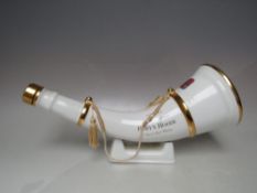 A WADE SPIRIT OF ROBYN HOODE WHISKY DECANTER IN THE FORM OF A HUNTING HORN WITH STAND, L 36