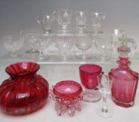 FOUR ITEMS OF VICTORIAN CRANBERRY GLASSWARE, to include a faceted glass bottle with stopper,