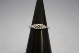 A PLATINUM SEVEN STONE DIAMOND RING, approx weight 3.4g, ring size L
